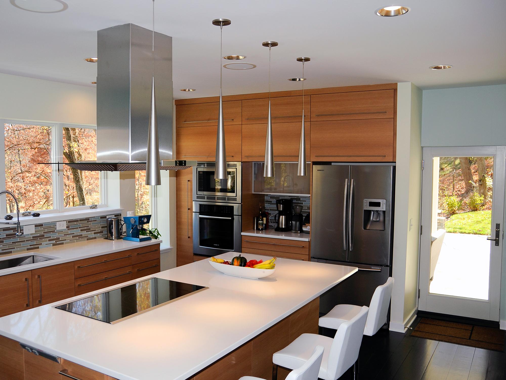 Living room converted to gourmet kitchen and glass staircase  