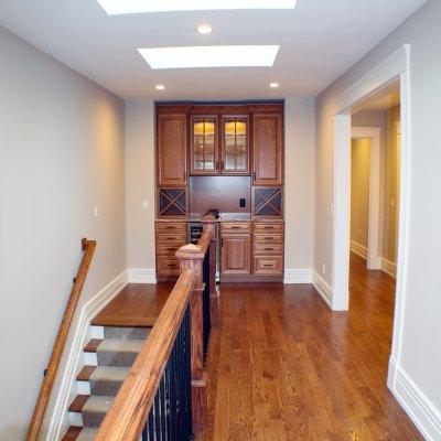 top floor stairs with sky lights